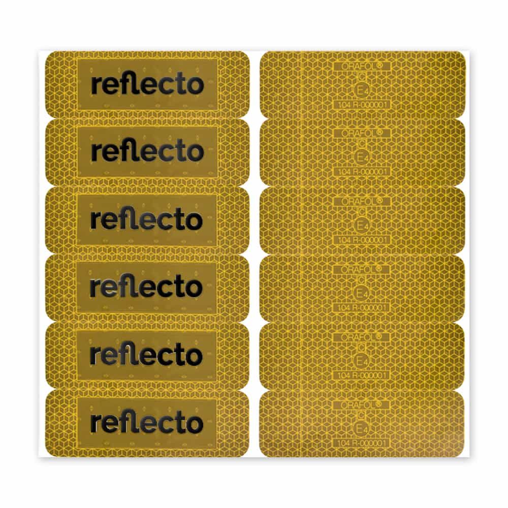 Gelber VC 104+ Stickerbogen: links Logo-Aufkleber, rechts E4-Homologationsfelder