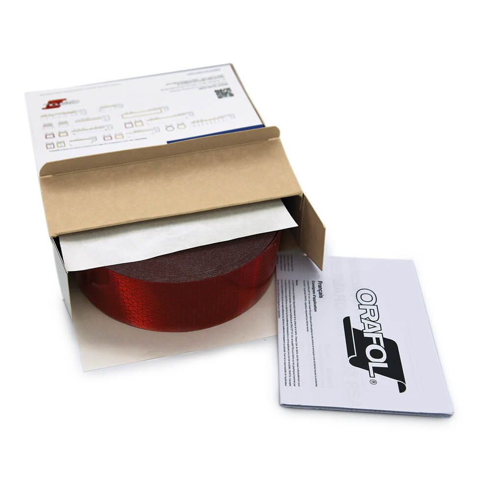 Geöffnete Orafol Box mit rotem VC 104+ CG Band und beiliegender Anleitung