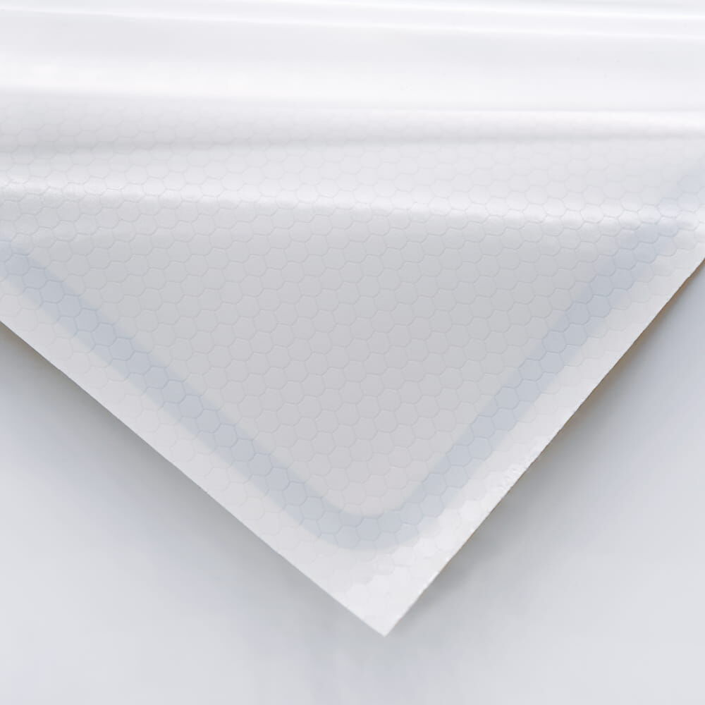 Rückseite der selbstklebenden Variante mit sichtbarer Klebeschicht auf weißem Träger