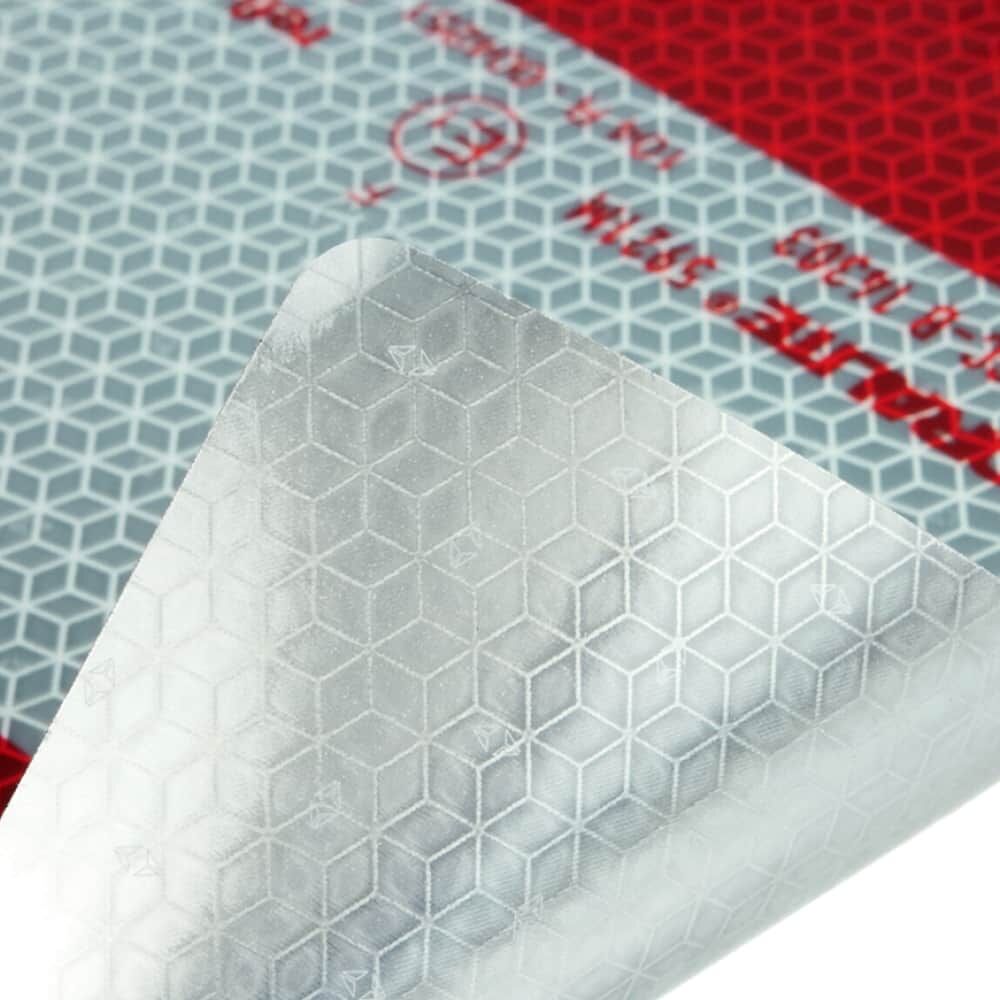 Detail: selbstklebende Rückseite/Folie wird abgezogen