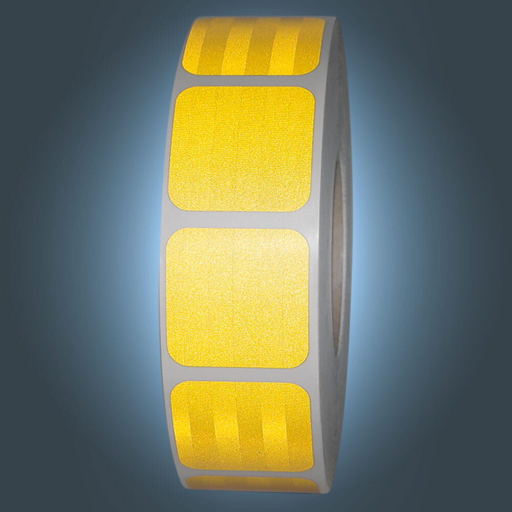 Rolle gelbes 3M 957 S Segmentband leuchtend vor dunklem Hintergrund