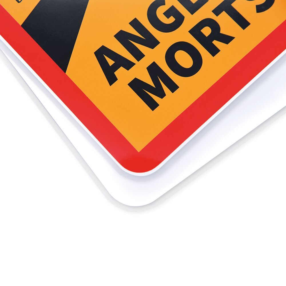 Nahaufnahme der Ecke des selbsthaftenden Warnschilds mit Reflexdruck