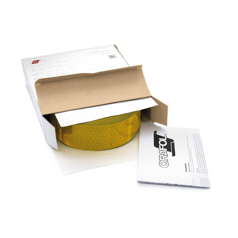 Geöffnete Orafol Box mit gelbem VC 104+ CG Band und beiliegender Anleitung