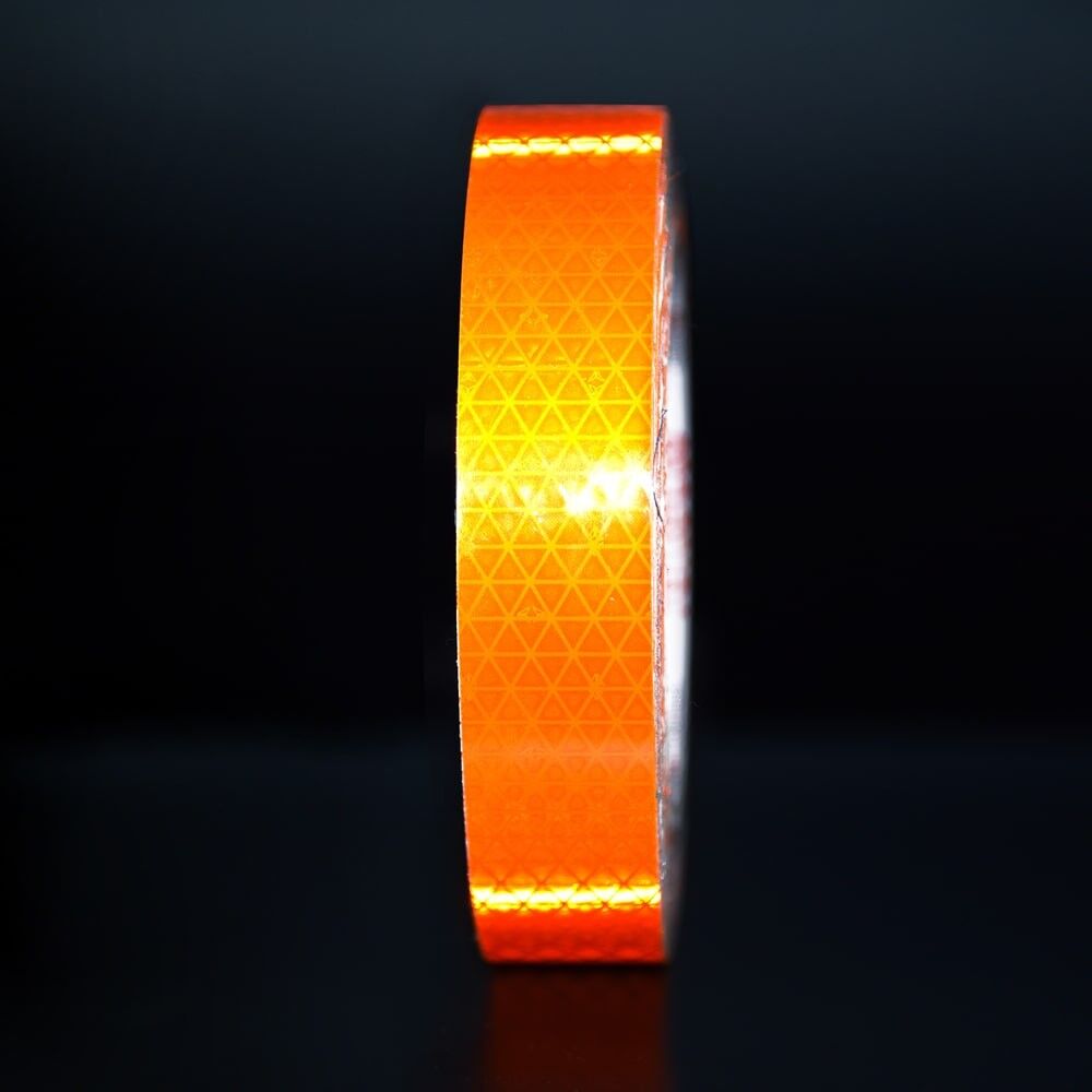 25 mm Rolle Orafol ORALITE Reflexband VC 612 fluor-orange, reflektierend vor dunklem Hintergrund