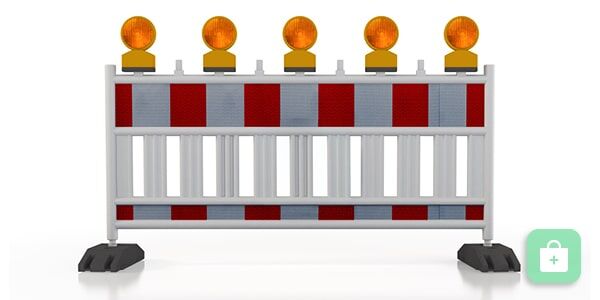 Eine rot-weiße Straßenabsperrung mit fünf orangefarbenen Warnleuchten auf einer Querstrebe