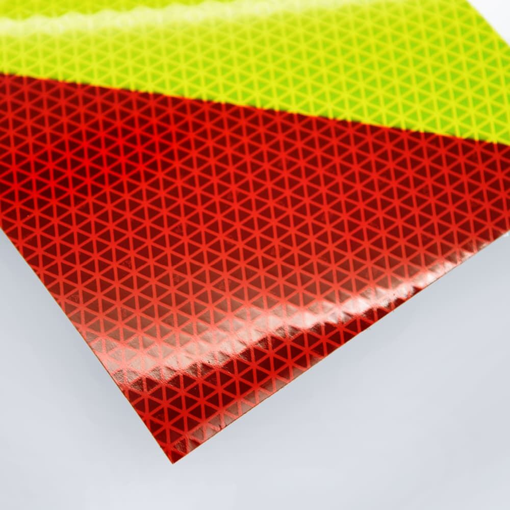 Nahaufnahme glänzende rote und fluor-lime Reflexfolie VC 612, Eckbereich