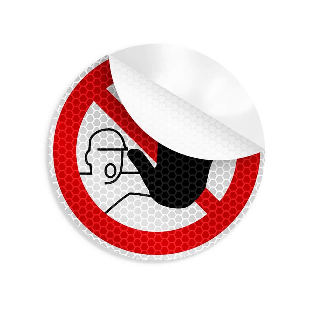 Teilweise abgelöster Aufkleber „Zutritt verboten“, zeigt Rückseite