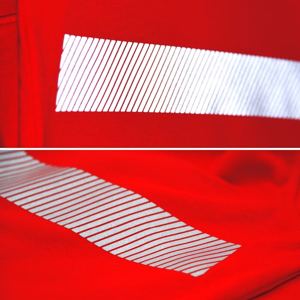 Roter Stoff mit aufpresstem 5510 M-Segmentband, schräge Reflexlinien.