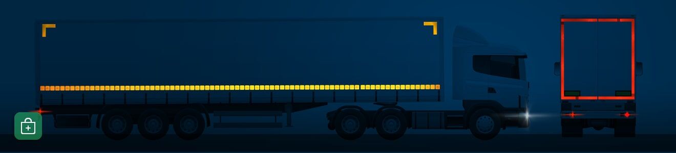 Eine Seitenansicht eines LKWs mit Anhänger in der Nacht, teilmarkiert durch gelbe und rote Konturmarkierungen.