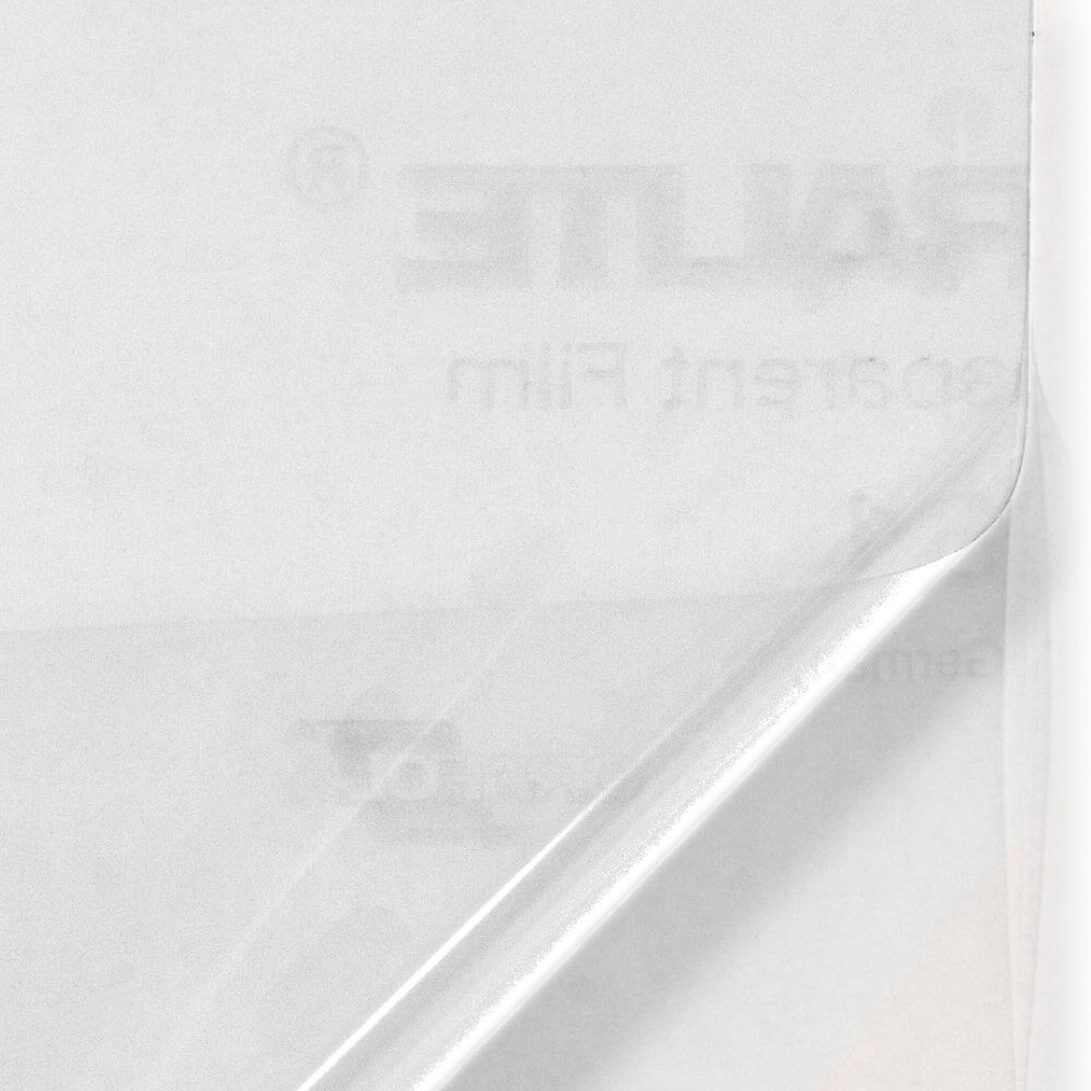 Orafol 5061 Overlay-Folie Transprent, Ecke abgezogen, zeigt Trägerpapier darunter