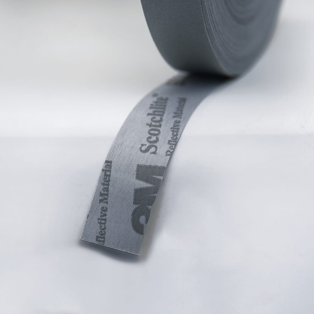 Rückseite des Reflexgewebes mit 3M Scotchlite-Aufdruck
