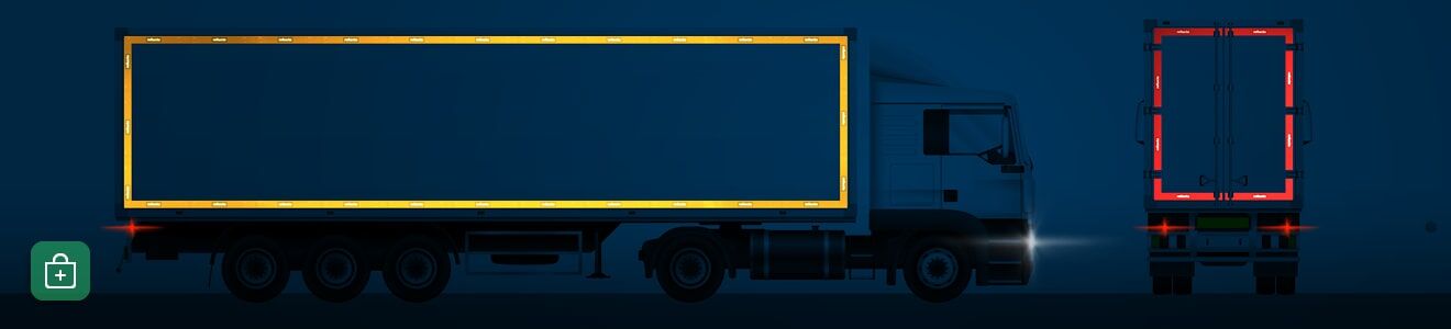 Eine Seitenansicht eines LKWs mit Anhänger in der Nacht, vollmarkiert durch gelbe und rote Konturmarkierungen.