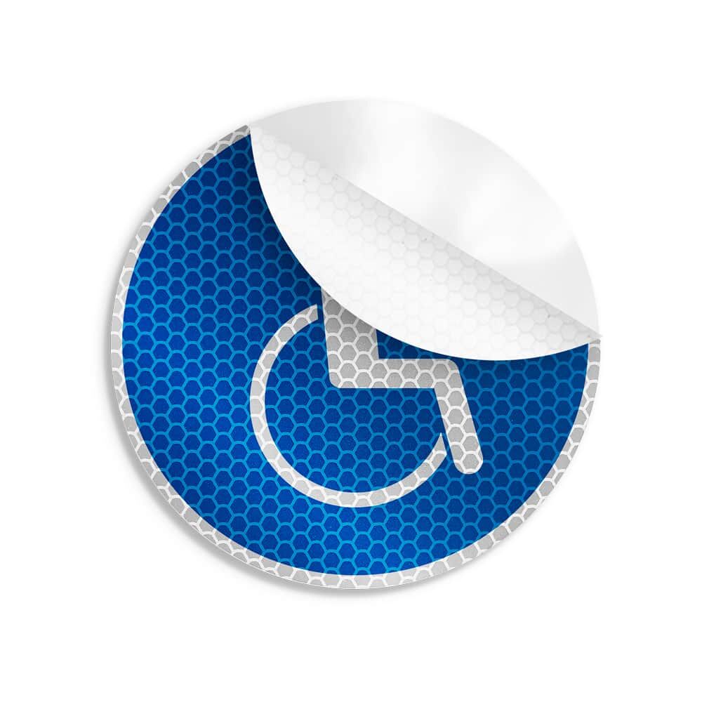 Teilweise abgelöster Aufkleber Rollstuhlfahrer, reflektierend, Ø 10 cm