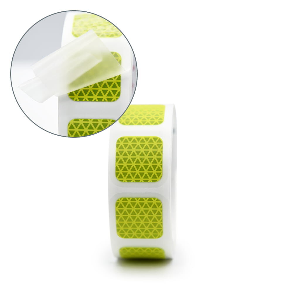 Rolle Orafol VC612 in fluorlime mit Detailansicht von abziehbaren Applikationstape